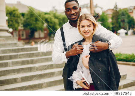 businesswoman with partner in a city businesswoman with partner in a city 49517843