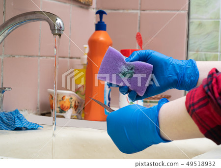 Kitchen sponge with a drop of cleaning agent. Kitchen sponge with a drop of cleaning agent. 49518932