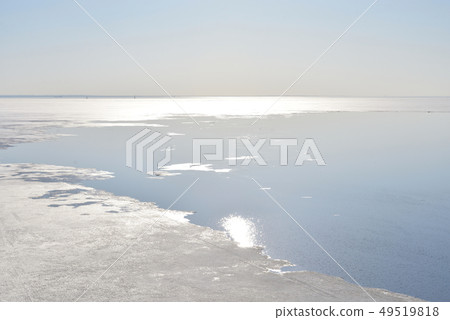 Frozen sea at sunny day. 49519818