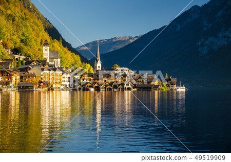 View of Hallstatt Hallstadt town with reflection in lake with blue sky above, Austria View of Hallstatt Hallstadt town with reflection in lake with blue sky above, Austria 49519909