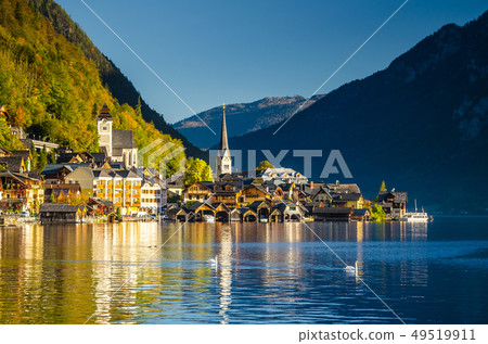 View of Hallstatt Hallstadt town with reflection in lake with blue sky above, Austria View of Hallstatt Hallstadt town with reflection in lake with blue sky above, Austria 49519911