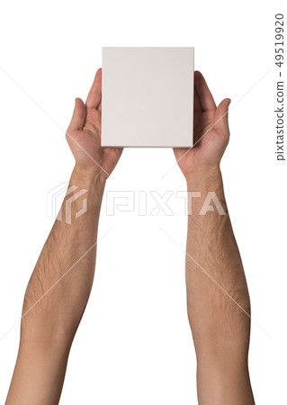 Small white cardboard boxes in male hands. Top Small white cardboard boxes in male hands. Top 49519920