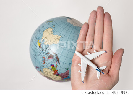 Passenger aircraft on the female palm on the Passenger aircraft on the female palm on the 49519923