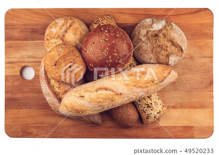 different types of bread on wooden kitchen cutting 49520233