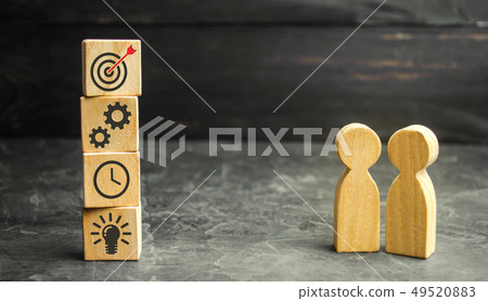 Two businessmen discuss business strategy. 49520883