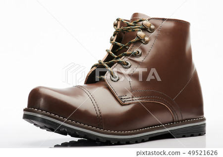 One dark brown leather shoe One dark brown leather shoe 49521626