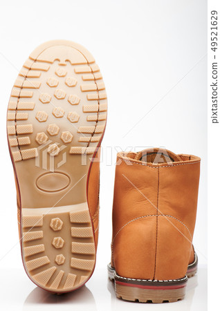 Back and sole of brown tall shoes 49521629