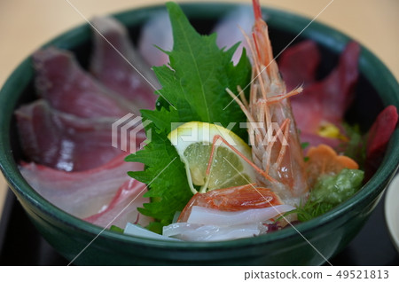 Bowl of rice topped with sashimi Bowl of rice topped with sashimi 49521813