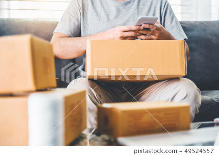 SME freelance man working with packaging startup 49524557