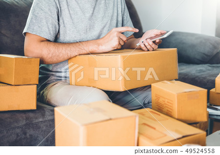 SME freelance man working with packaging startup SME freelance man working with packaging startup 49524558