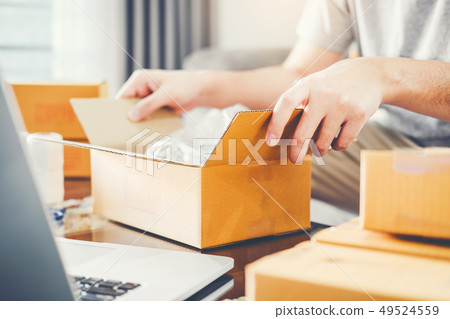 SME freelance man working with packaging startup SME freelance man working with packaging startup 49524559