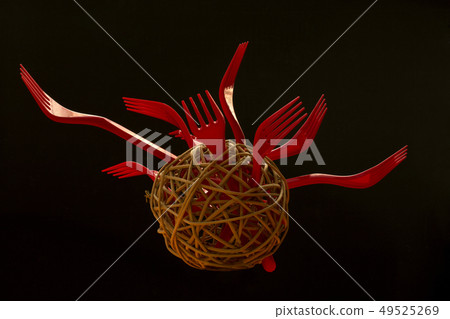 Abstract still life with red forks in a round Abstract still life with red forks in a round 49525269