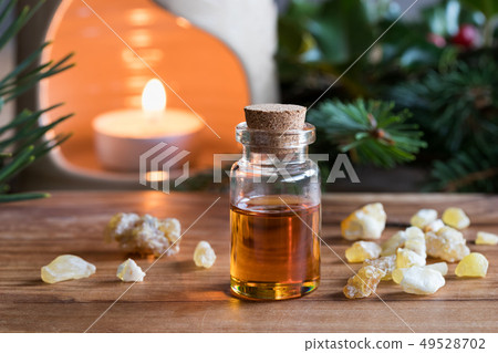 A bottle of frankincense essential oil with A bottle of frankincense essential oil with 49528702