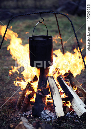 tourist's bowler campfire. A Pot Of Food  49529916