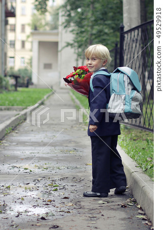 Schoolboy on his way to the school.  49529918