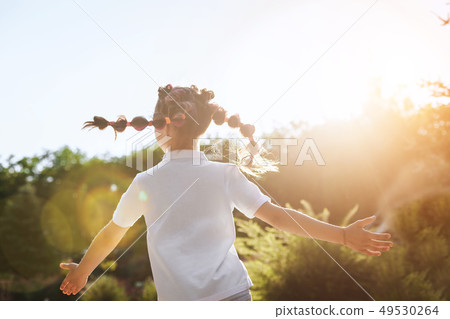 child girl running in the park child girl running in the park 49530264
