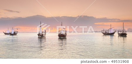 Traditional Arabic Dhow boats in Doha harbour, Qatar Traditional Arabic Dhow boats in Doha harbour, Qatar 49531908