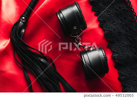 BDSM sex toys for domination and submission. Whip with handcuffs 49532003