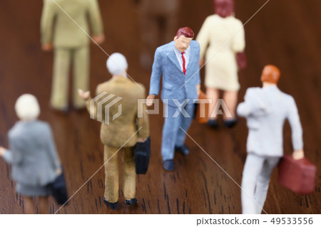 Man going against the crowd 49533556