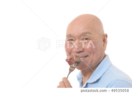 Japanese senior eating steak Japanese senior eating steak 49535058