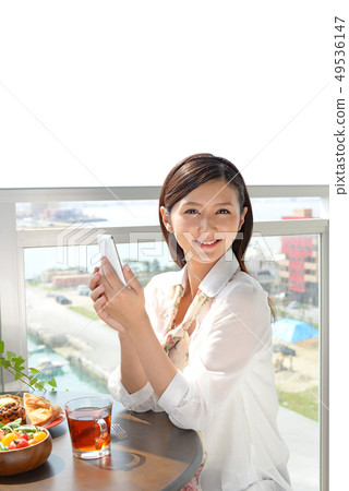 Woman with smartphone Woman with smartphone 49536147