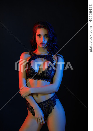 Sexy woman in lace black sensual lingerie with long curly hair Sexy woman in lace black sensual lingerie with long curly hair 49536438