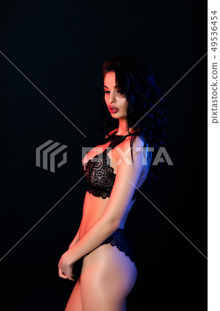 Sexy woman in lace black sensual lingerie with long curly hair 49536454