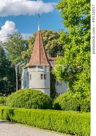 A low tower of the castle with a red roof and slit A low tower of the castle with a red roof and slit 49538057