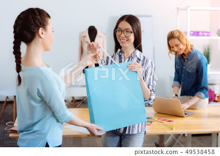 Charming foreign girl taking her purchase 49538458