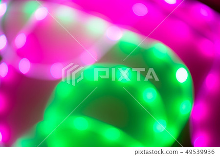 Abstract background of blurred neon green and pink lines. Abstract background of blurred neon green and pink lines. 49539936