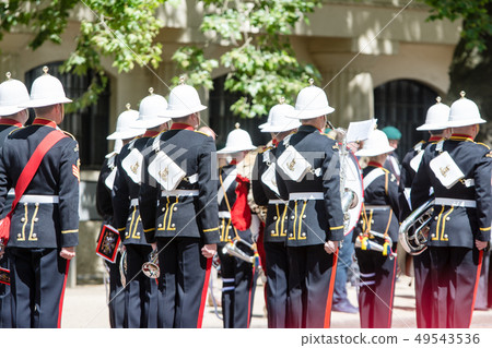 Guards line up in the bright sunshine Cite of London, England 49543536