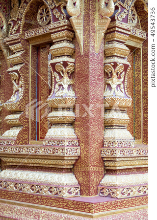 Golden stucco on the window frame . 49543736