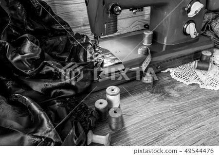 monochrome still life with vintage sewing machine 49544476