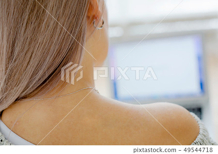 Blond young girl with long hair in a cozy interior Blond young girl with long hair in a cozy interior 49544718