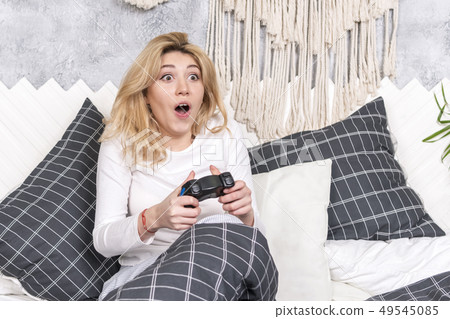 woman playing a game woman playing a game 49545085