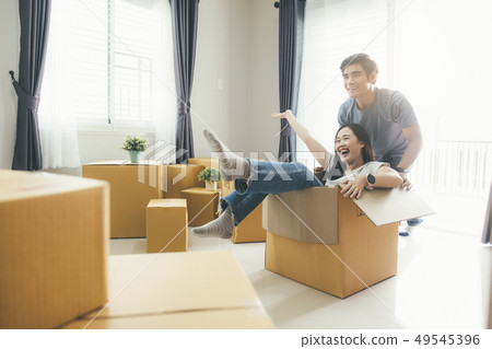 Happy young couple enjoying together moving in a 49545396