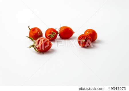 ugly cherry tomato with mold  49545973