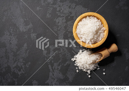 Walnut in wooden bowl on black background with Walnut in wooden bowl on black background with 49546047