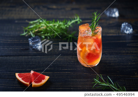 Gin cocktail with rosemary and grapefruit top Gin cocktail with rosemary and grapefruit top 49546994
