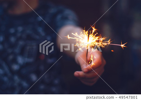 Christmas, New year sparkler in woman hands. Christmas, New year sparkler in woman hands. 49547801