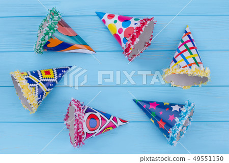 Set of party hats on blue background. Set of party hats on blue background. 49551150
