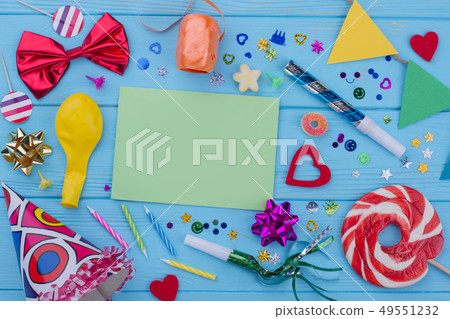 Birthday accessories on blue wood. 49551232