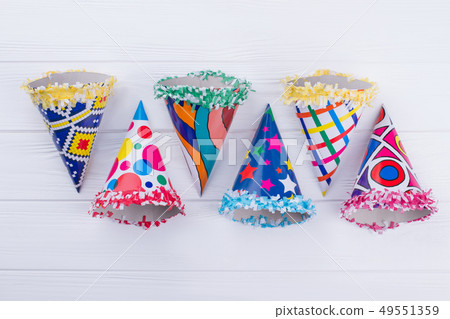 Flat lay colorful party cone hats. Flat lay colorful party cone hats. 49551359