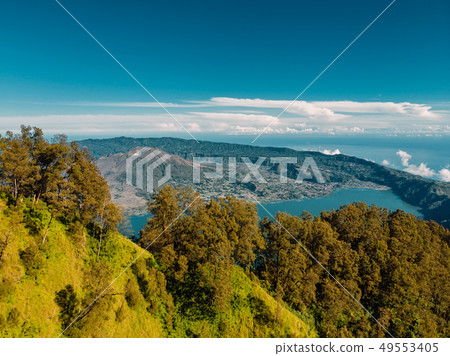 Aerial view of Batur volcano and lake with forest Aerial view of Batur volcano and lake with forest 49553405