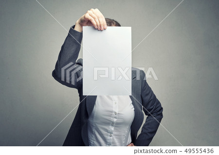 anonymous woman covering face with paper sheet anonymous woman covering face with paper sheet 49555436