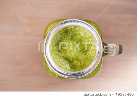 A green smoothie in a mason jar 49555490