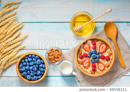 Healthy breakfast with oat flakes and  fresh 49556151
