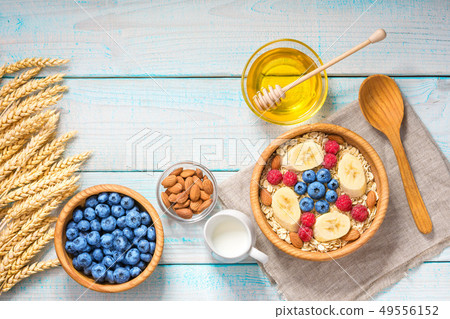 Healthy breakfast with oat flakes, natural milk, 49556152