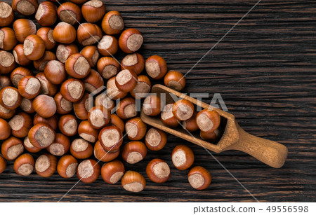 hazelnut on a brown wooden table,top view hazelnut on a brown wooden table,top view 49556598