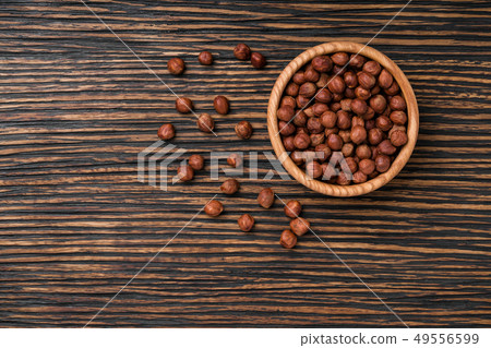 hazelnut on a brown wooden table,top view hazelnut on a brown wooden table,top view 49556599